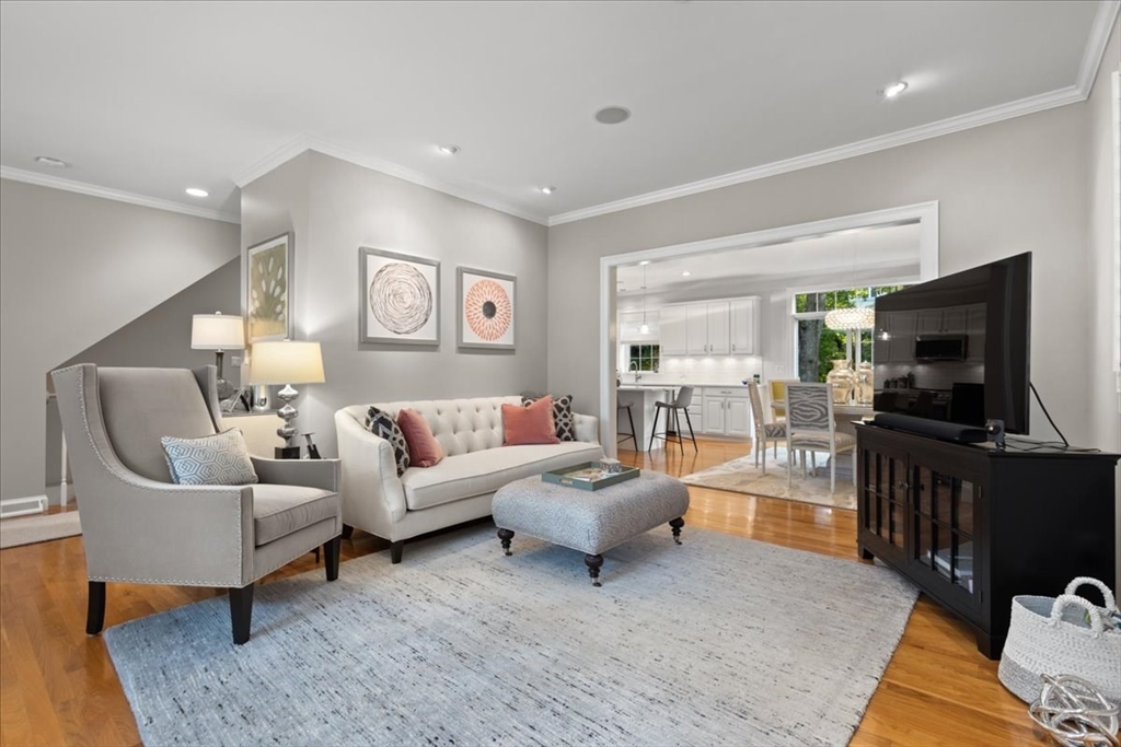 923 Lagrange Street, Unit 923 Boston, MA 02132 - Photo 10 of 32 a living room with furniture and a flat screen tv