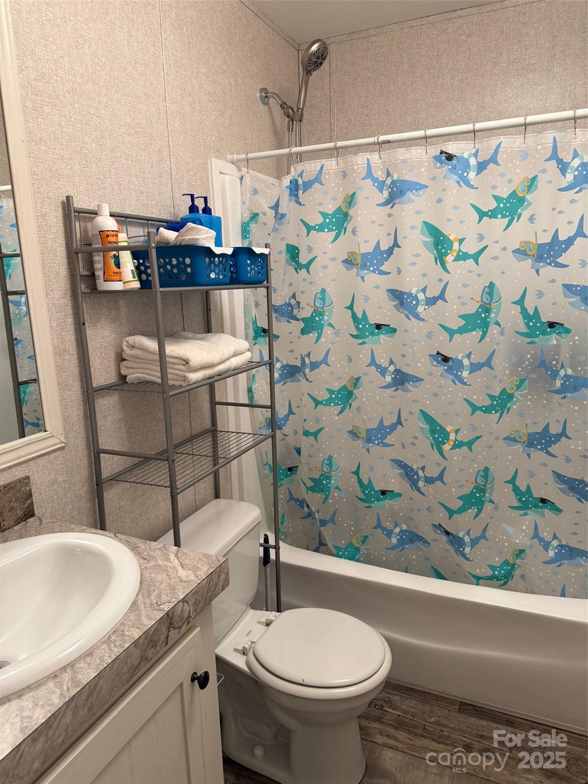 891 Longbranch Road Jefferson, SC 29718 - Photo 13 of 21 a bathroom with a sink toilet and shower