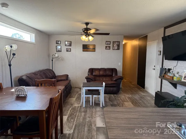 a living room with furniture and a closet