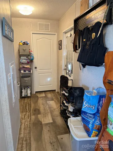 a bedroom with a bed and dresser with mirror