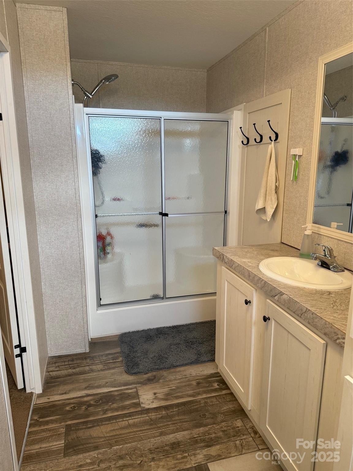 891 Longbranch Road Jefferson, SC 29718 - Photo 21 of 21 a bathroom with a sink and a mirror