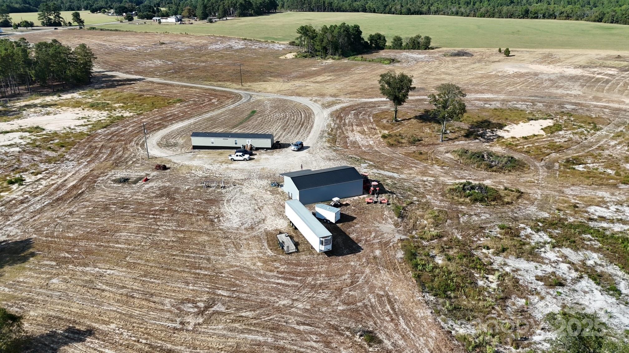 891 Longbranch Road Jefferson, SC 29718 - Photo 4 of 21 a view of a backyard of a house