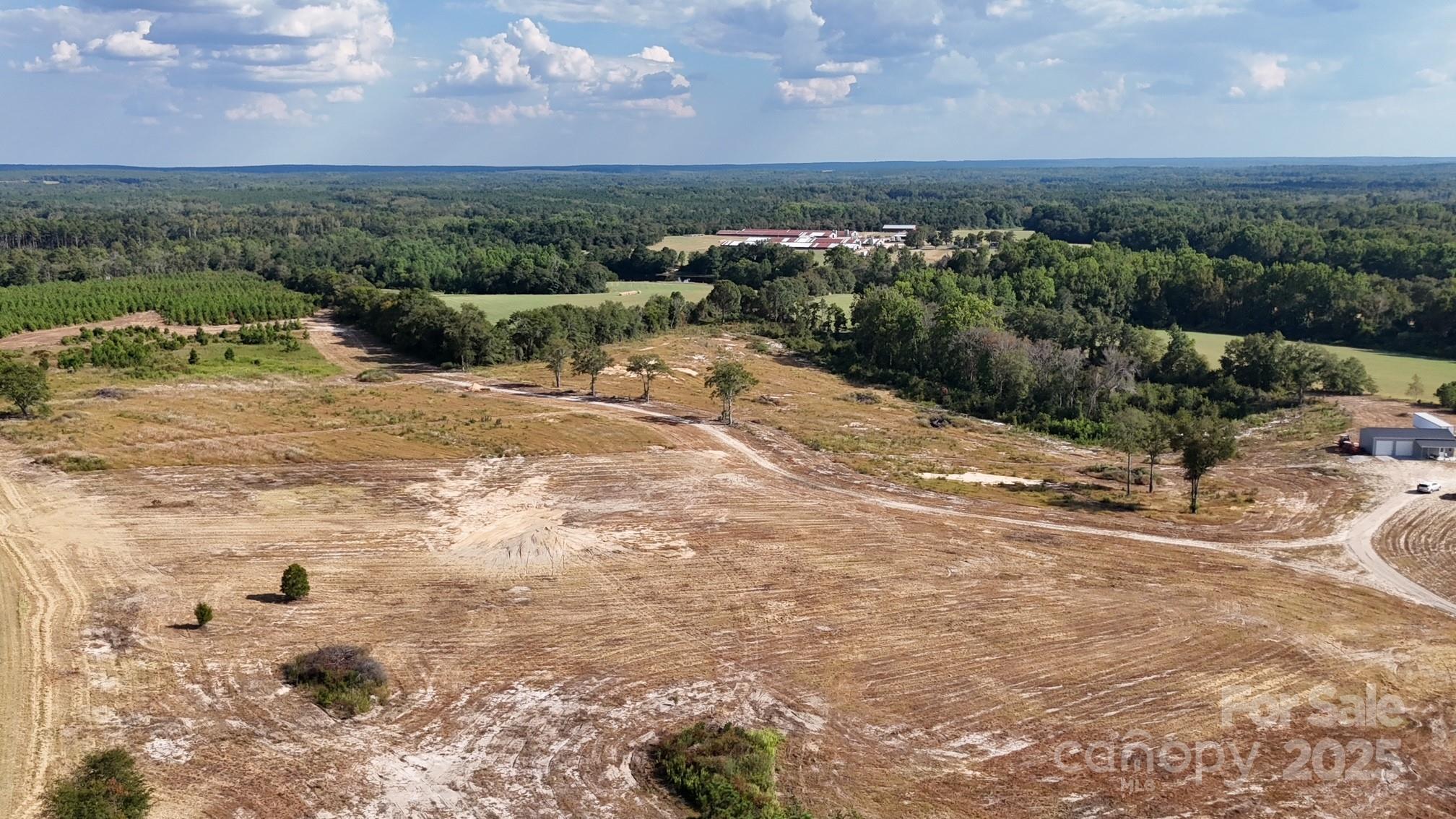 891 Longbranch Road Jefferson, SC 29718 - Photo 5 of 21 a view of a dry yard with wooden fence