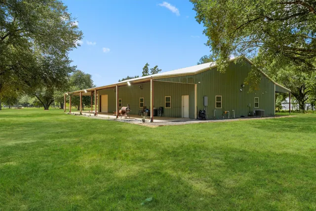 a view of a house with a big yard