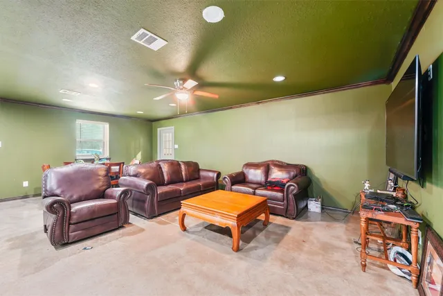 a kitchen with stainless steel appliances granite countertop a refrigerator a stove a sink and a microwave