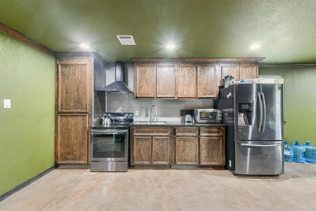 a bedroom with a bed and a desk