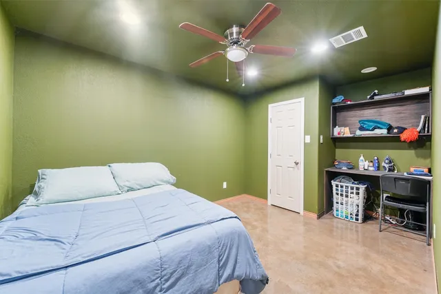 a bathroom with a sink a toilet and shower curtain