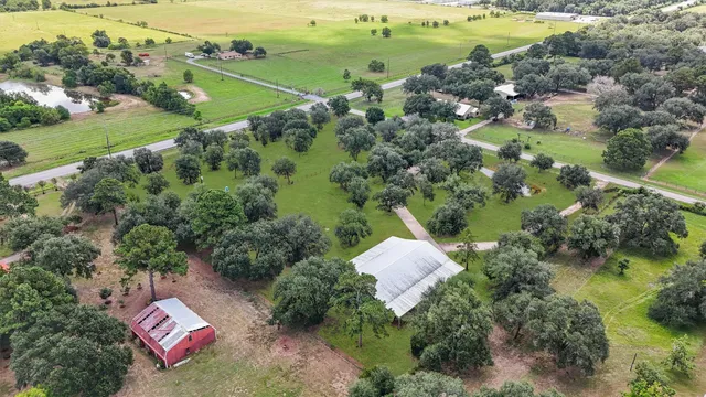 an aerial view of a golf course with parking space