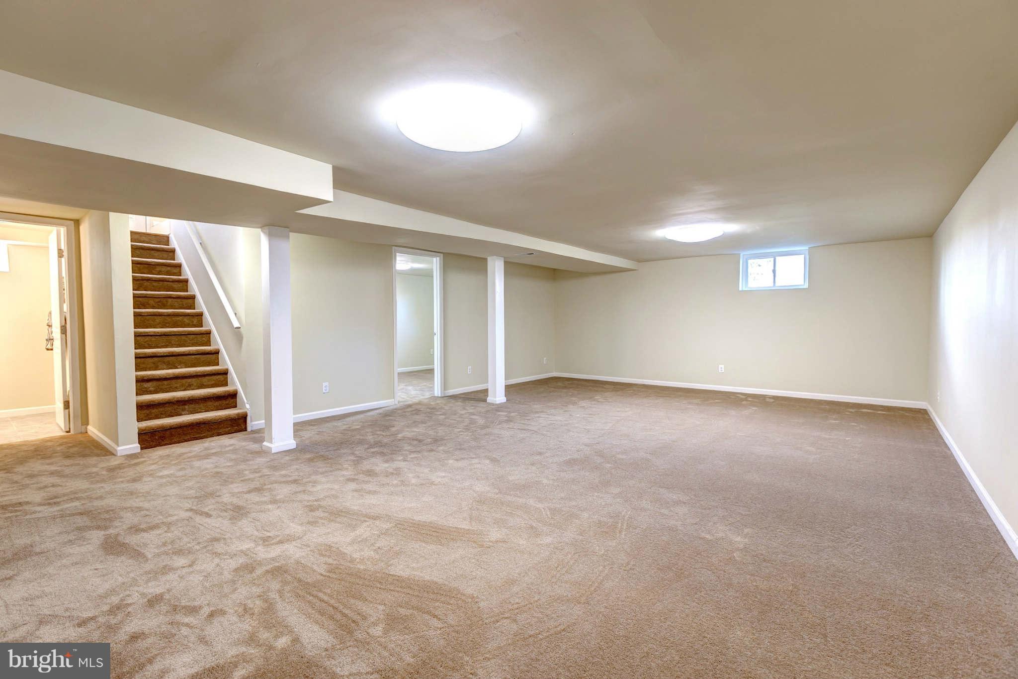 3702 Pinelea Road Baltimore, MD 21244 - Photo 22 of 29 a view of an empty room with stairs