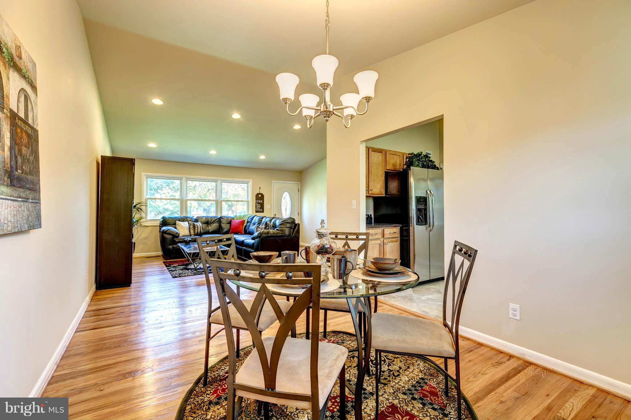 3702 Pinelea Road Baltimore, MD 21244 - Photo 8 of 29 a view of a dining room with furniture and wooden floor
