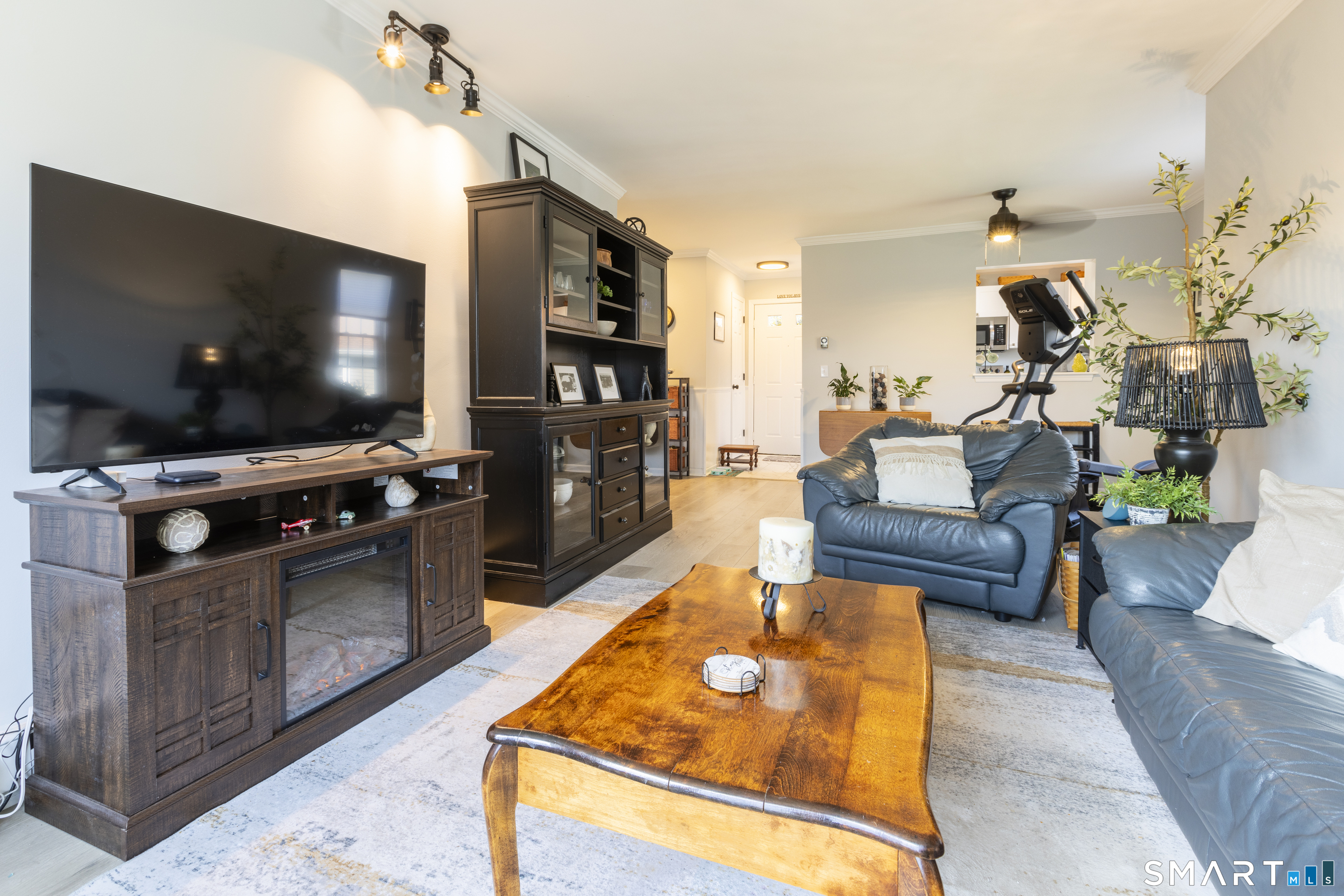 53 Brushy Plain Road, Unit 6E Branford, CT 06405 - Photo 5 of 13 a living room with furniture and a flat screen tv