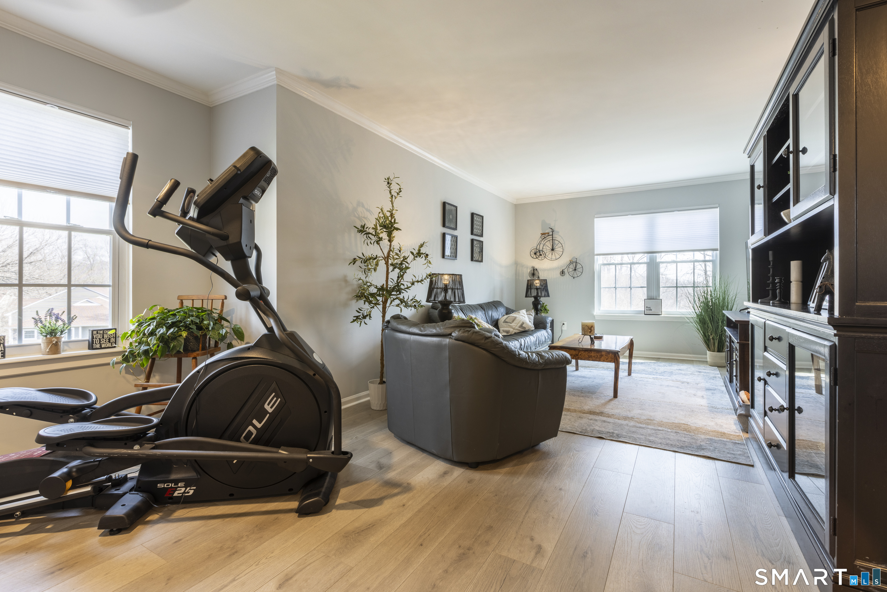 53 Brushy Plain Road, Unit 6E Branford, CT 06405 - Photo 6 of 13 a living room with furniture a flat screen tv and a window