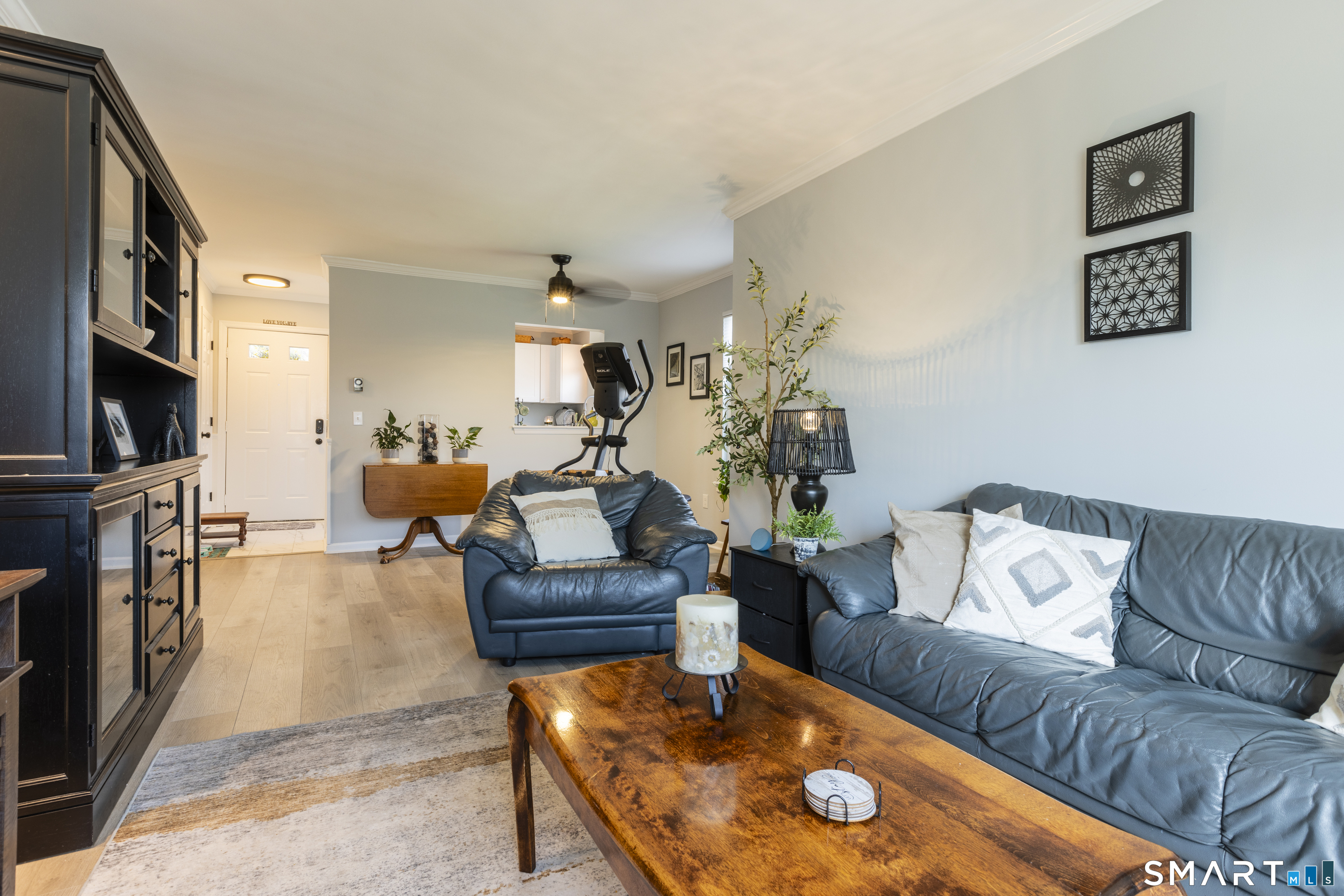 53 Brushy Plain Road, Unit 6E Branford, CT 06405 - Photo 7 of 13 a living room with furniture and a flat screen tv