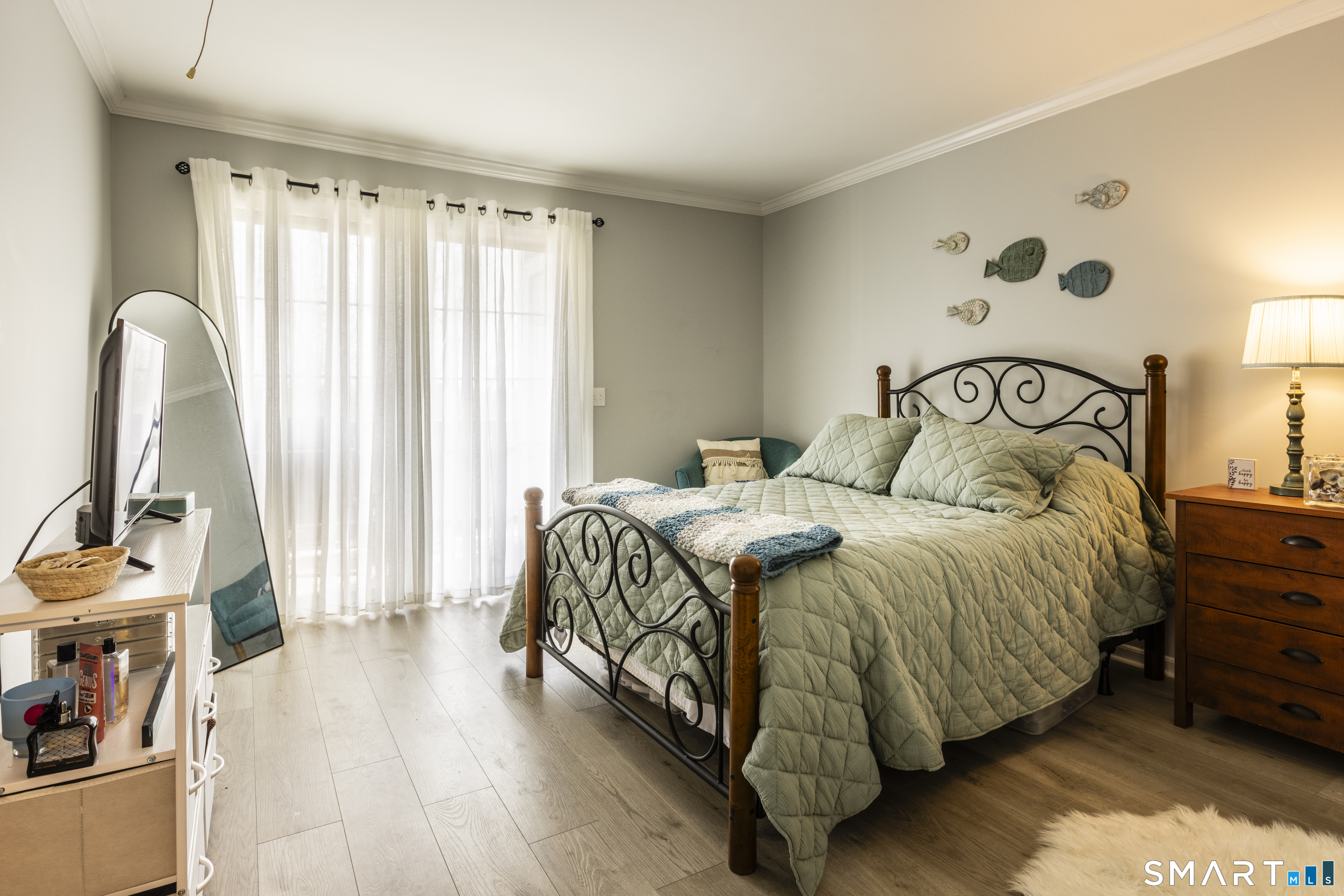 53 Brushy Plain Road, Unit 6E Branford, CT 06405 - Photo 8 of 13 a bedroom with a bed and a window