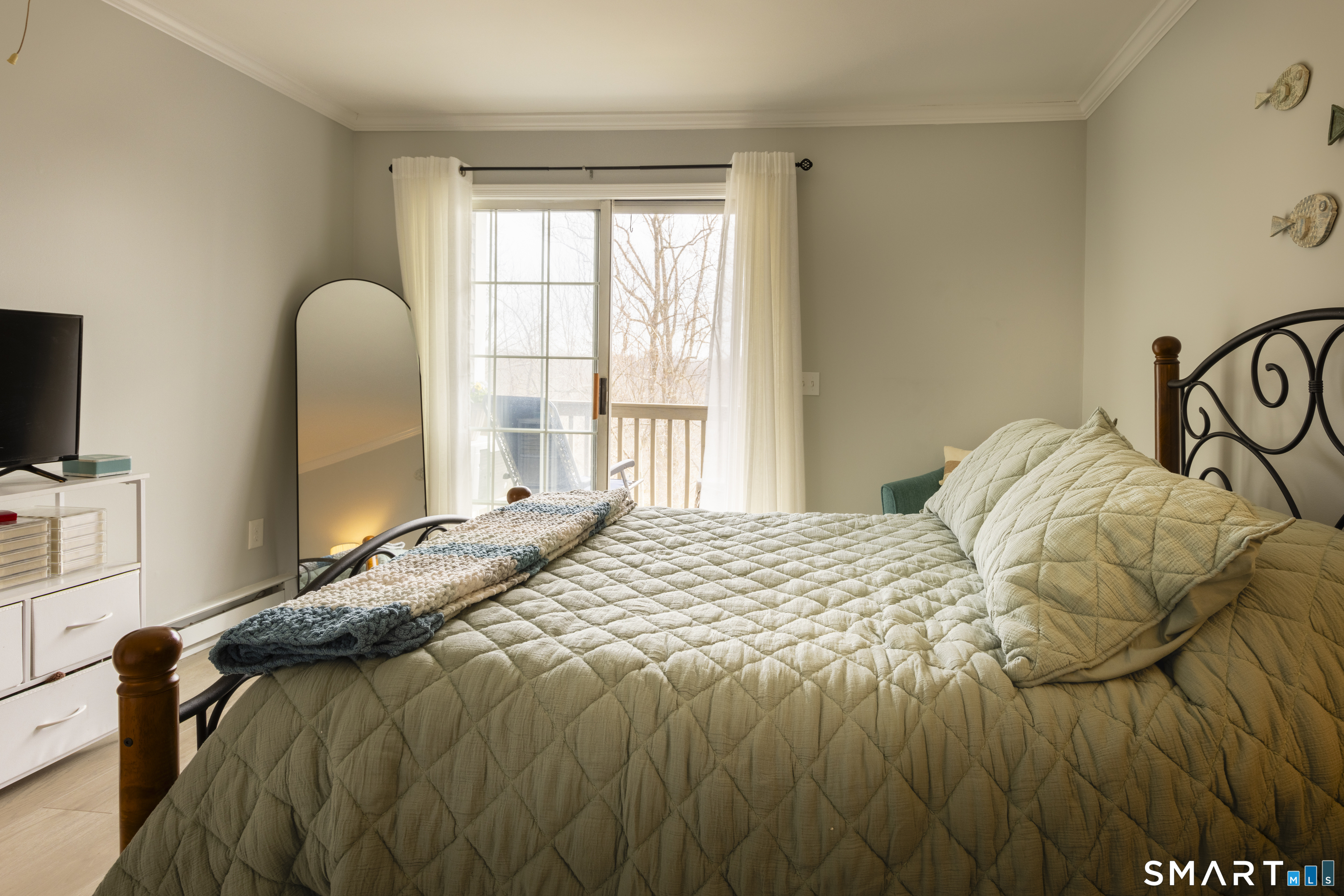 53 Brushy Plain Road, Unit 6E Branford, CT 06405 - Photo 9 of 13 a bedroom with a bed and a window