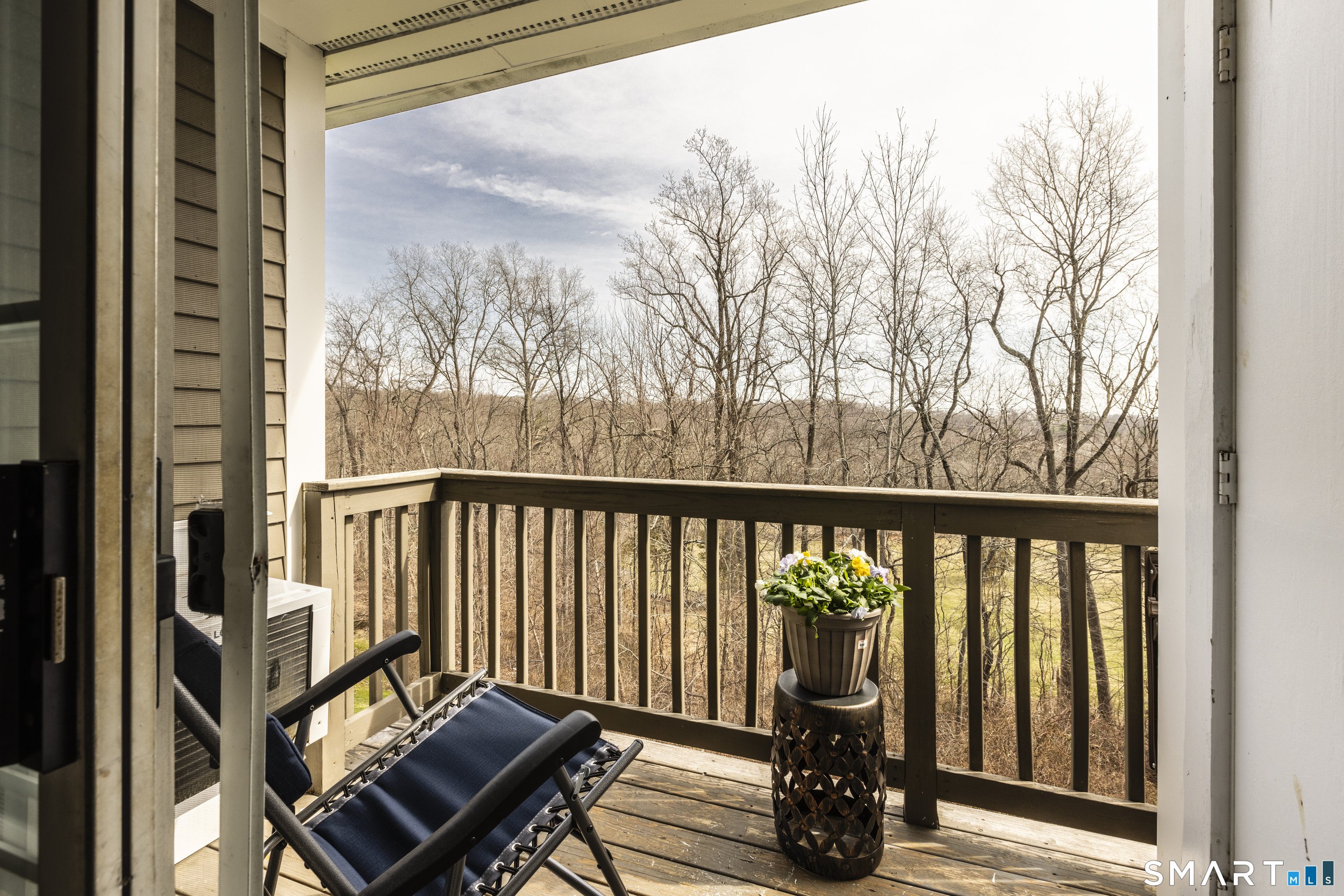 53 Brushy Plain Road, Unit 6E Branford, CT 06405 - Photo 10 of 13 a view of a two chairs in the balcony