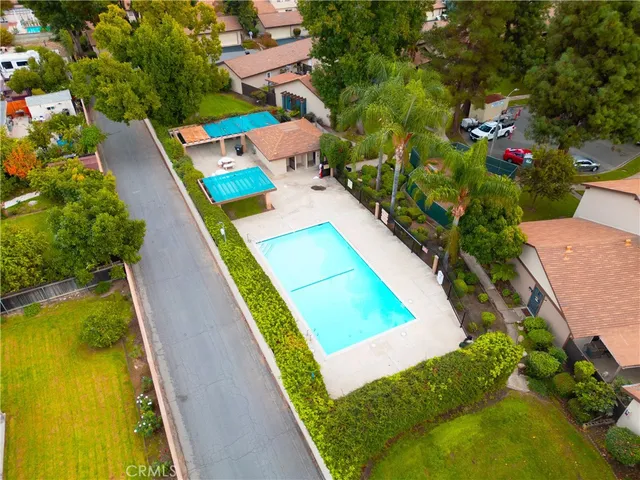 an aerial view of a house with swimming pool
