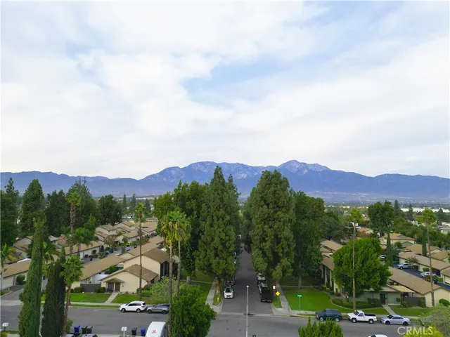 an aerial view of residential house with green space
