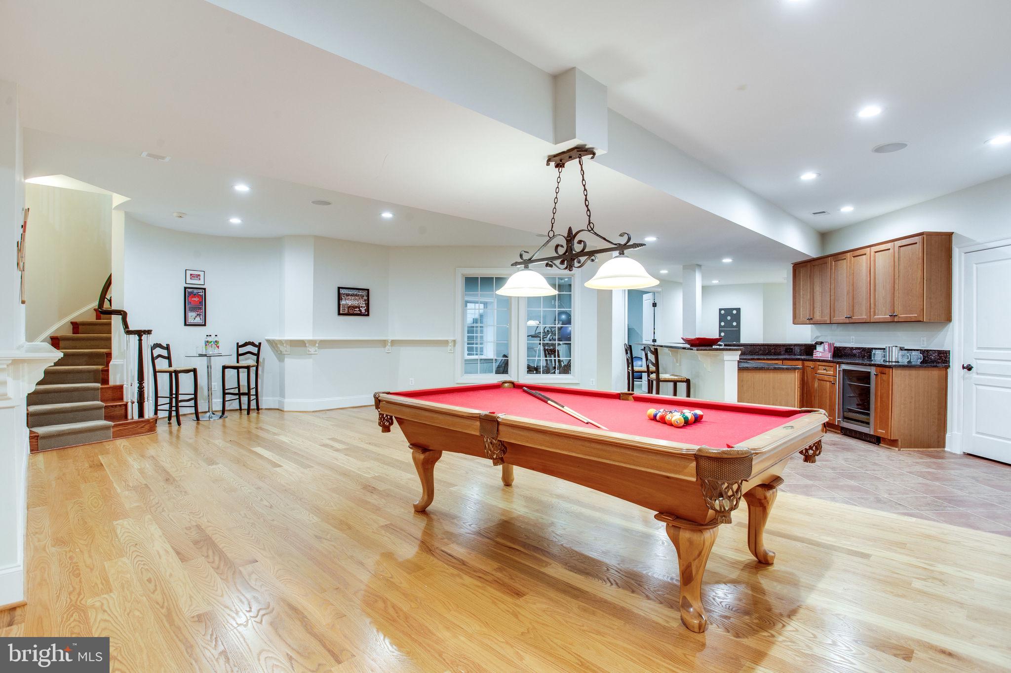 10464 Springvale Meadow Lane Great Falls, VA 22066 - Photo 63 of 103 Curved staircase up to foyer