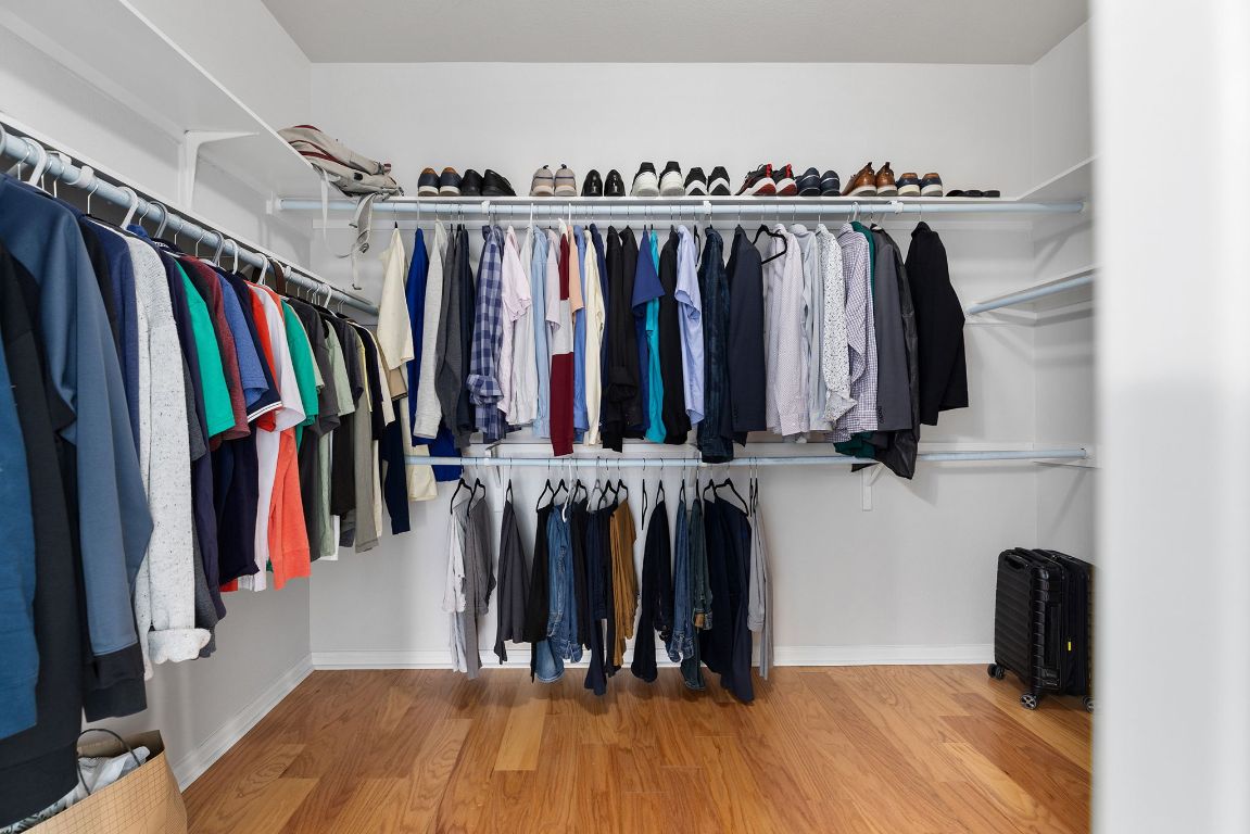 701 Old Ravine Court Round Rock, TX 78665 - Photo 19 of 40 Spacious closet featuring wood finished floors and radiator heating unit