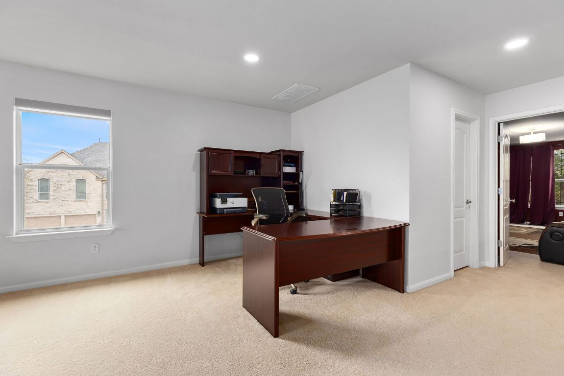 701 Old Ravine Court Round Rock, TX 78665 - Photo 20 of 40 Office featuring light colored carpet and recessed lighting