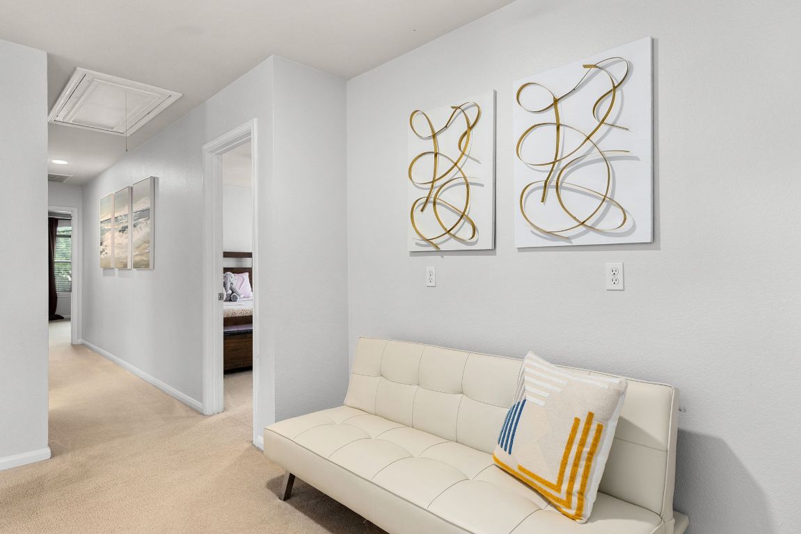 701 Old Ravine Court Round Rock, TX 78665 - Photo 26 of 40 Living area with attic access and light colored carpet