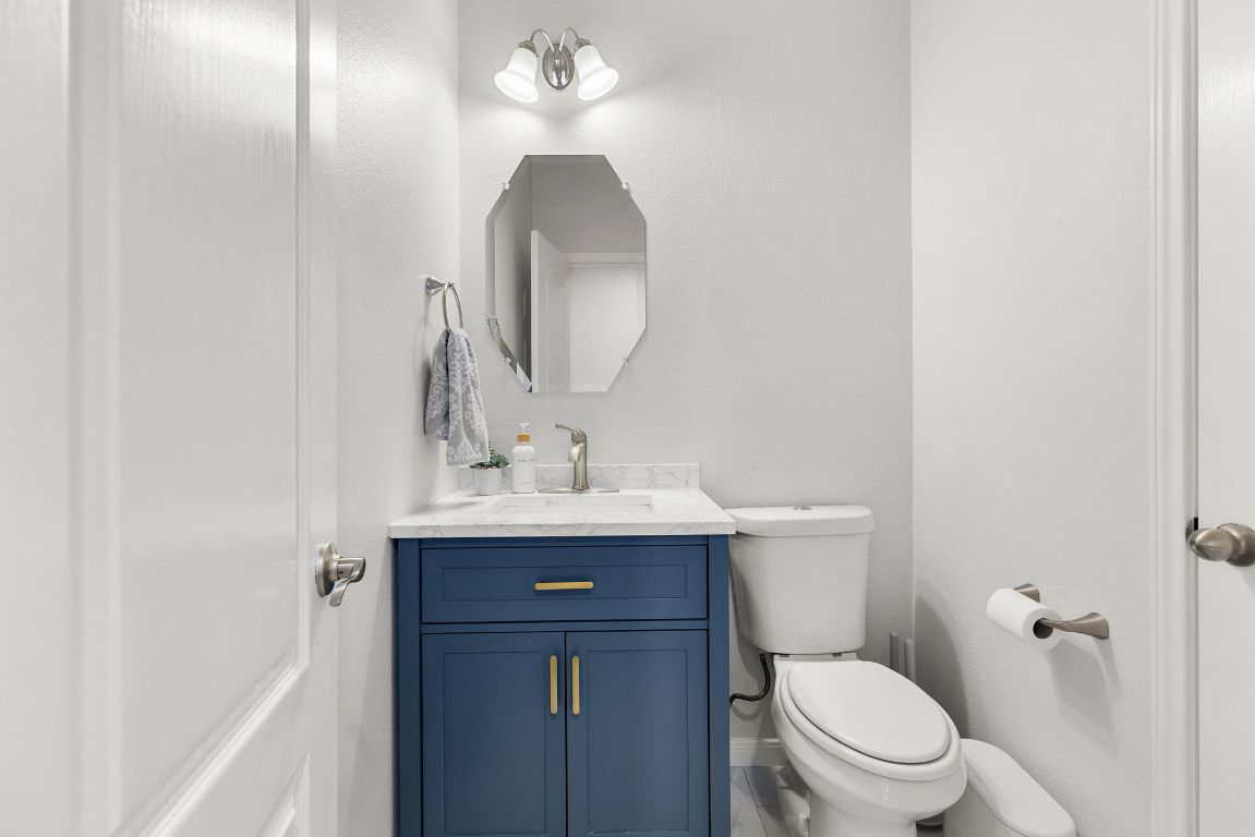 701 Old Ravine Court Round Rock, TX 78665 - Photo 32 of 40 Bathroom featuring vanity and toilet