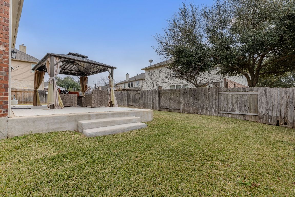 701 Old Ravine Court Round Rock, TX 78665 - Photo 36 of 40 Fenced backyard featuring a gazebo and a patio area