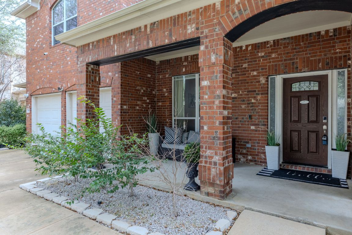 701 Old Ravine Court Round Rock, TX 78665 - Photo 37 of 40 View of exterior entry with brick siding and an attached garage
