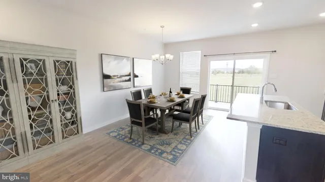 a view of a a dining room with furniture window and outside view