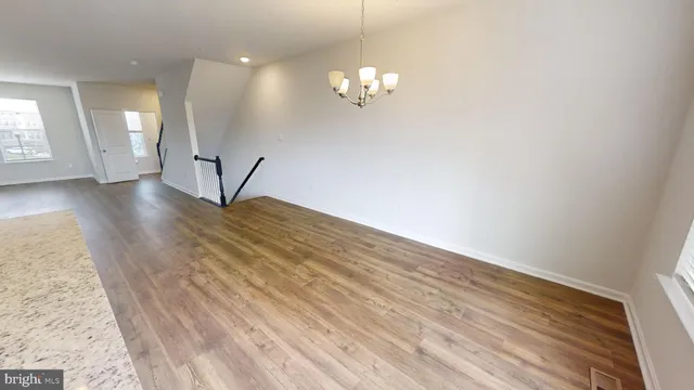 a view of livingroom with hardwood floor and a ceiling fan