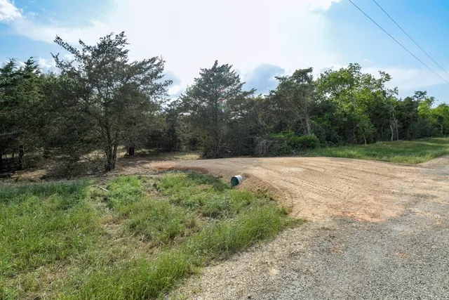 a backyard of a house with lots of green space