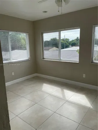 a view of a livingroom with an empty space and window