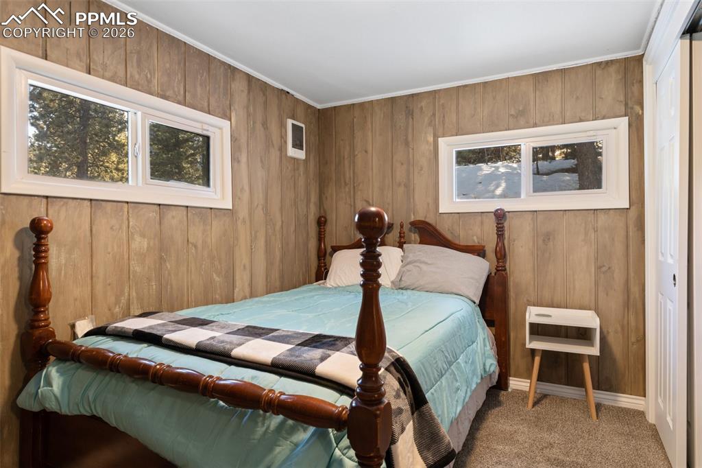 6230 Waterfall Loop Manitou Springs, CO 80829 - Photo 13 of 22 a bedroom with a bed and a painting on the wall