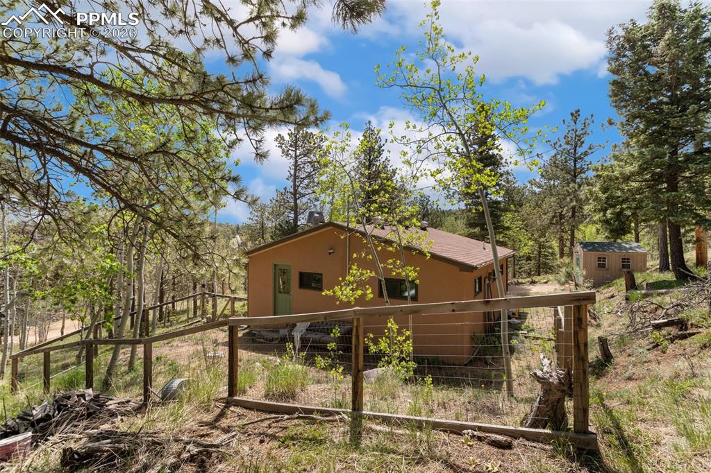 6230 Waterfall Loop Manitou Springs, CO 80829 - Photo 20 of 22 a view of a house with a small yard