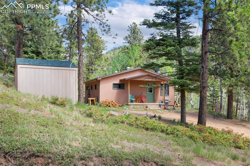 6230 Waterfall Loop Manitou Springs, CO 80829 - Photo 22 of 22 a front view of a house with garden