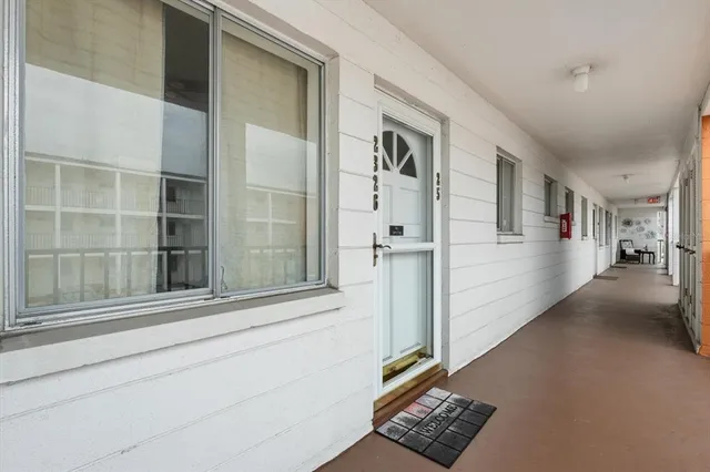 a view of staircase with lots of wooden floor and a window