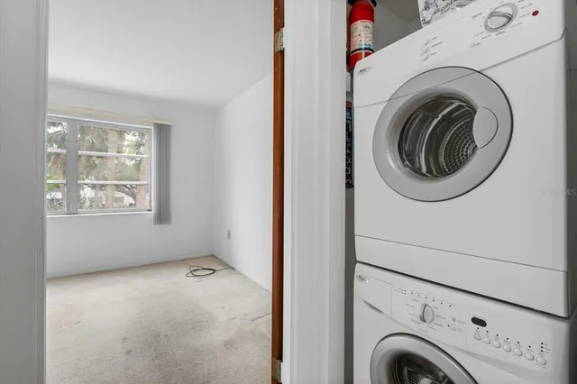 a view of a hallway with washer and dryer