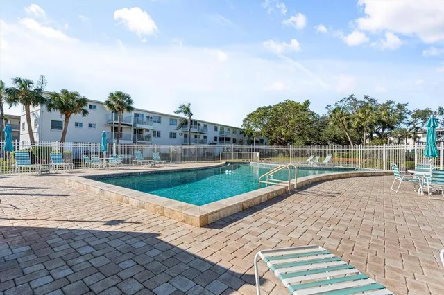 a view of swimming pool from a balcony