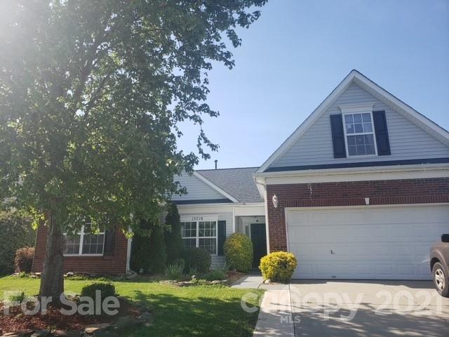 15710 Pedlar Mills Road Charlotte, NC 28278 - Photo 1 of 2 a front view of a house with garden