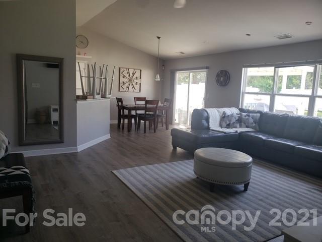15710 Pedlar Mills Road Charlotte, NC 28278 - Photo 2 of 2 a living room with furniture and a large window