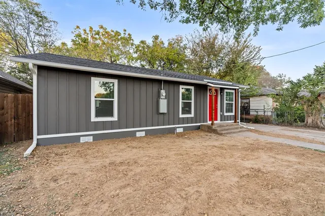 a house with trees in the background