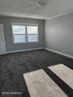 an empty room with wooden floor