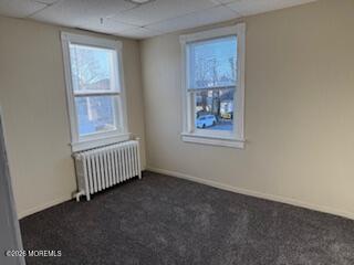 561 Summer Street, Unit 2 Long Branch, NJ 07740 - Photo 6 of 18 an empty room with windows