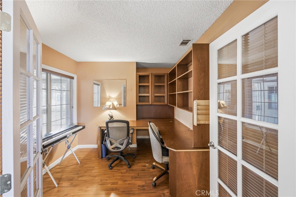 1539 Robyn Street Redlands, CA 92374 - Photo 21 of 47 a view of workspace with wooden floor and windows