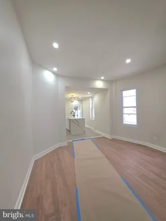 a view of an empty room and a window