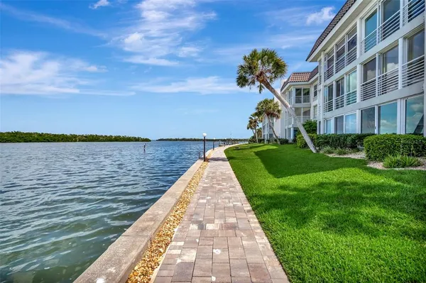 a view of a lake with a yard