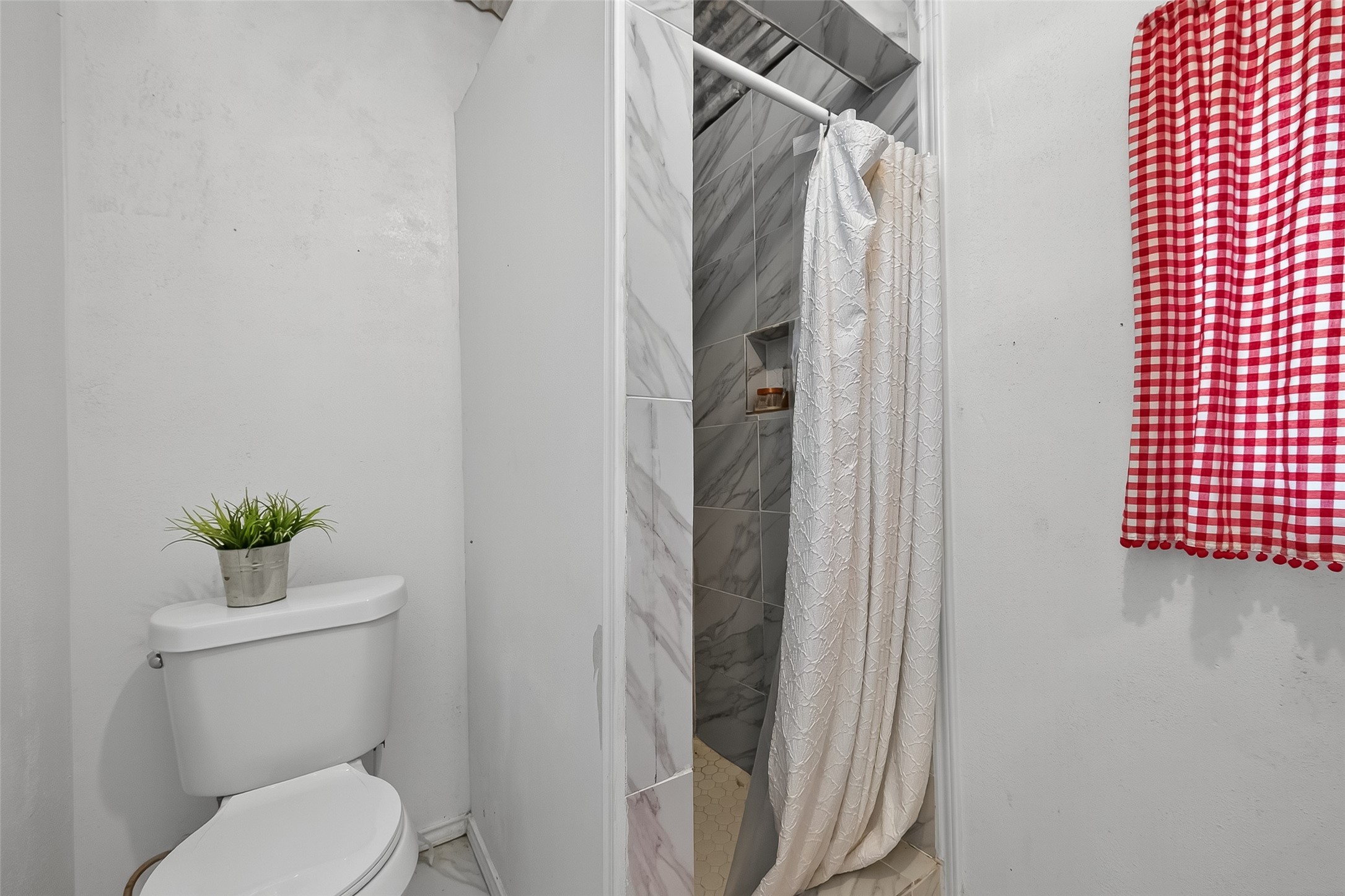 200 Our Road Shepherd, TX 77371 - Photo 16 of 46 a bathroom with a toilet and a shower