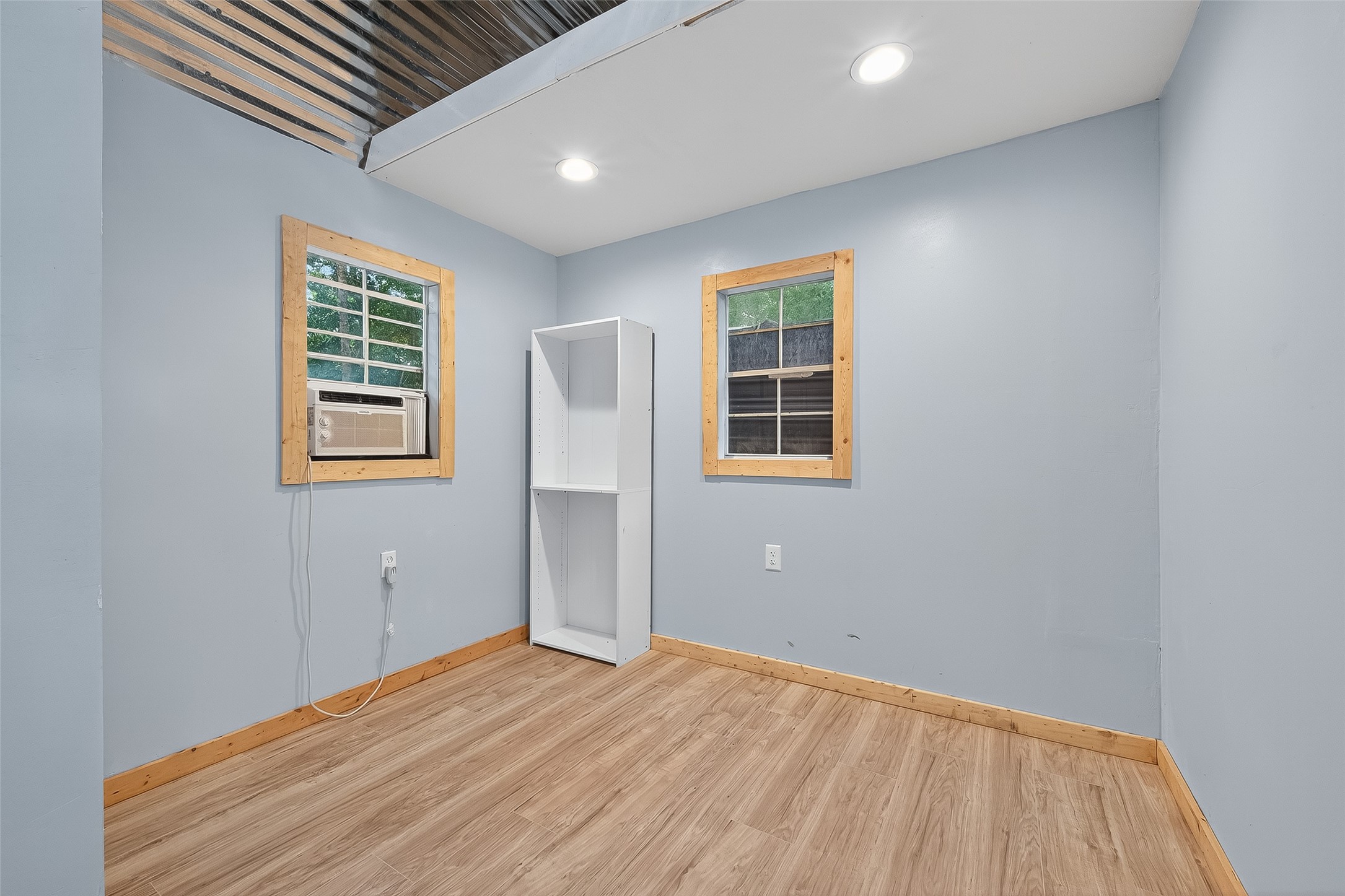 200 Our Road Shepherd, TX 77371 - Photo 18 of 46 a view of empty room with wooden floor and fan