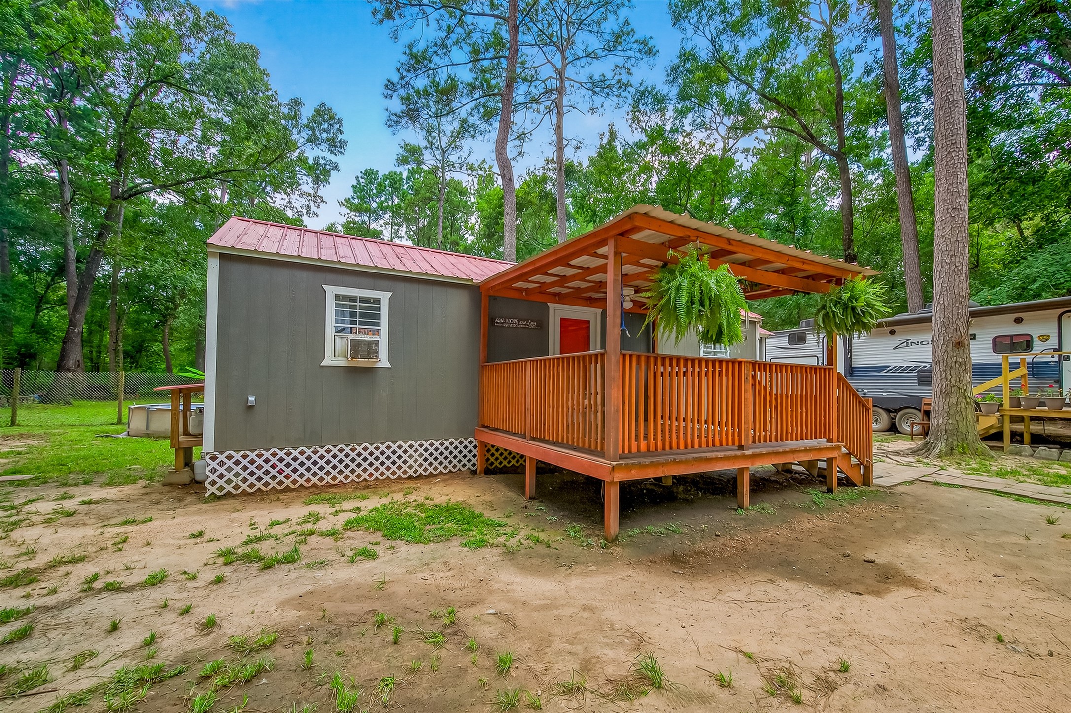 200 Our Road Shepherd, TX 77371 - Photo 2 of 46 a small pool sitting in the middle of a yard